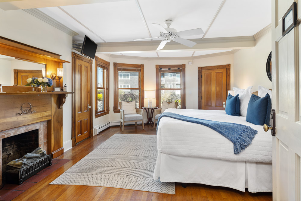 beautifully restored from hardwood floor to (decorative) fireplace, to beamed ceiling. This first floor garden view room offers a king bed, private bath (shower over tub) and bay windowed sitting area