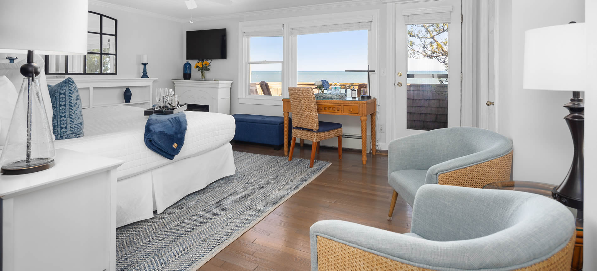 cape cod oceanfront bed and breakfast room with view and bed and sitting chairs
