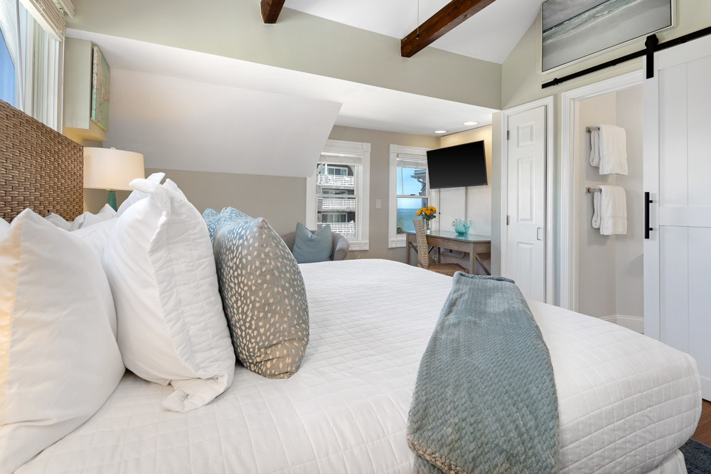 Juniper Point offers a king bed, private bath with walk-in shower, and a lovely partial ocean view. Plus TV.