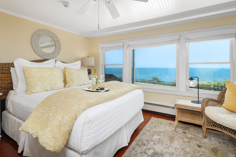 cape cod oceanfront bed and breakfast room with view and bed and side tables